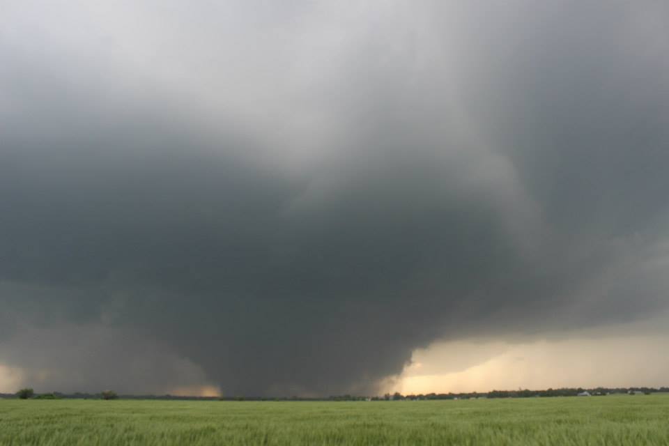 The partially rain obscured wedge tornado. In this photo the southern edge of the tornado can be clearly seen but the northern edge is difficult to differentiate from the rain.